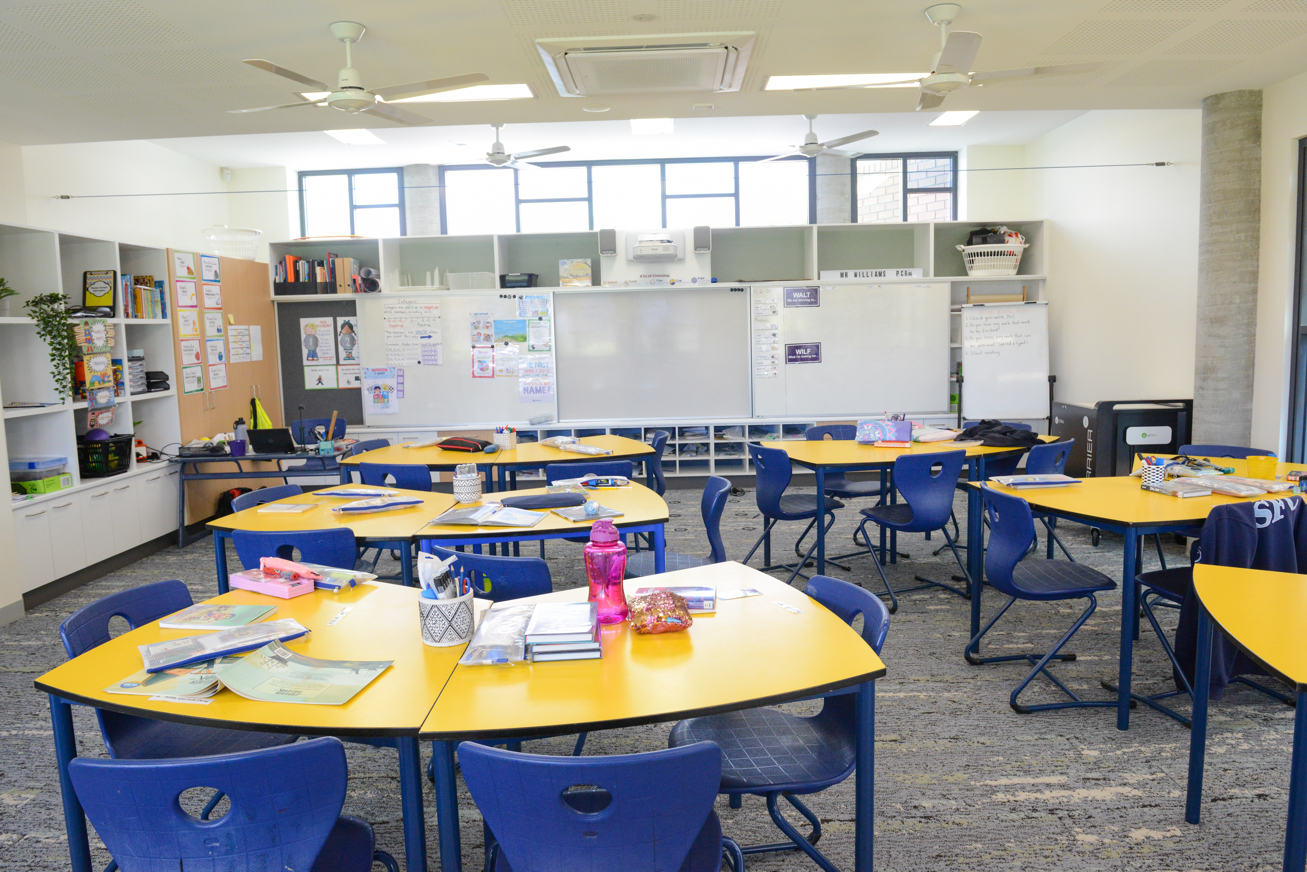 Upper primary or secondary classroom layout featuring flexible group tables and organised learning spaces supporting collaborative teaching and learning